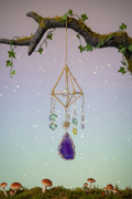 Crystal pyramid suncatcher in mystical forest