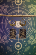 Magician tarot earrings on branch